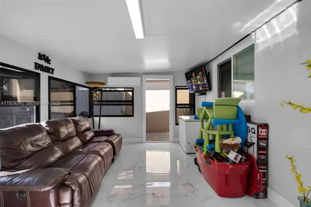 a living room with furniture and a window