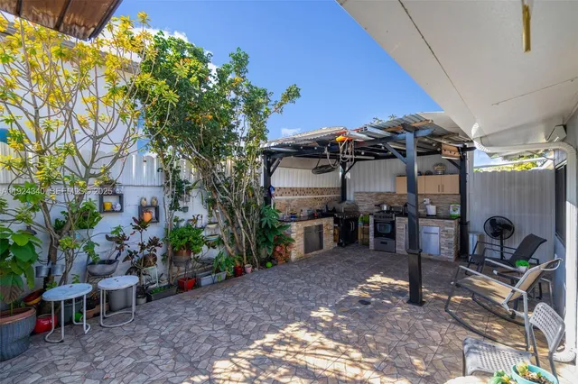 a view of a garage with a table and a chairs