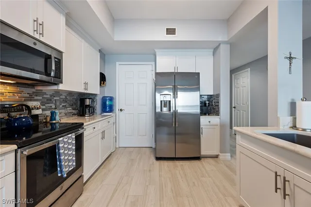 a kitchen with a table and chairs in it