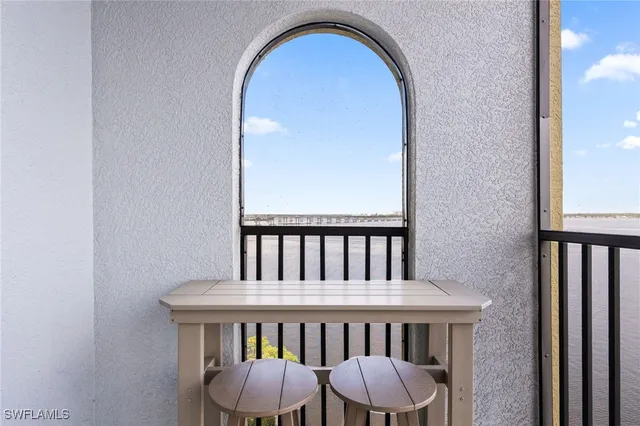 a view of an empty room with windows