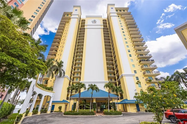 a view of a tall building with a clock on the wall
