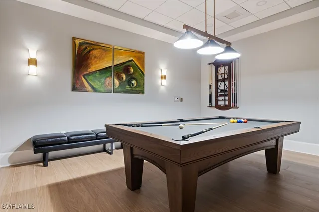 a living room with furniture a rug and a painting on the wall