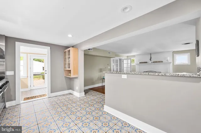 a living room with furniture and a rug