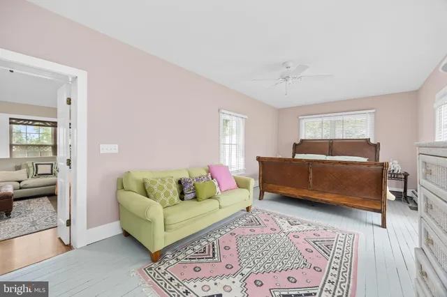 a bathroom with a toilet a sink and shower