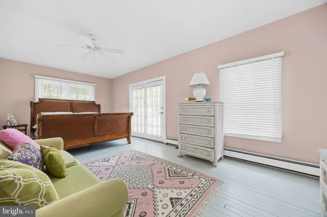 a room with a dresser and a window