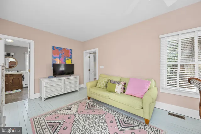a view of an entryway with wooden floor