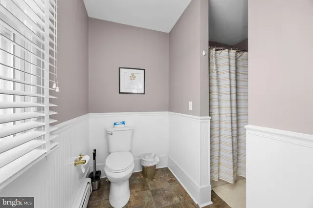 a view of a deck with wooden floor and next to a yard