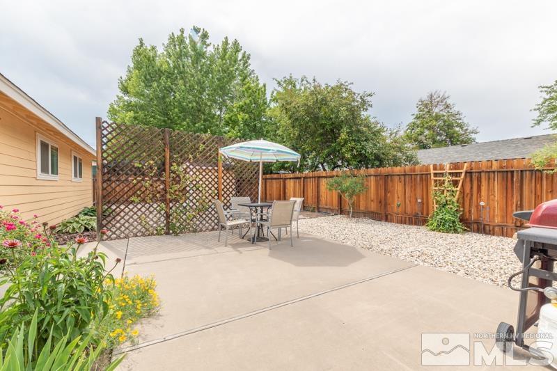 4375 Valdez Way Reno, NV 89502 - Photo 16 of 22 a backyard of a house with table and chairs