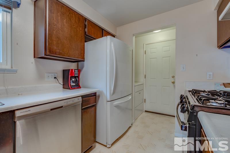 4375 Valdez Way Reno, NV 89502 - Photo 4 of 22 a kitchen with stainless steel appliances a refrigerator and a stove top oven