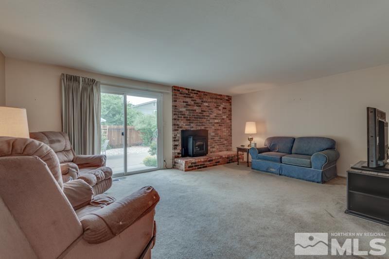 4375 Valdez Way Reno, NV 89502 - Photo 7 of 22 a living room with furniture and a fireplace