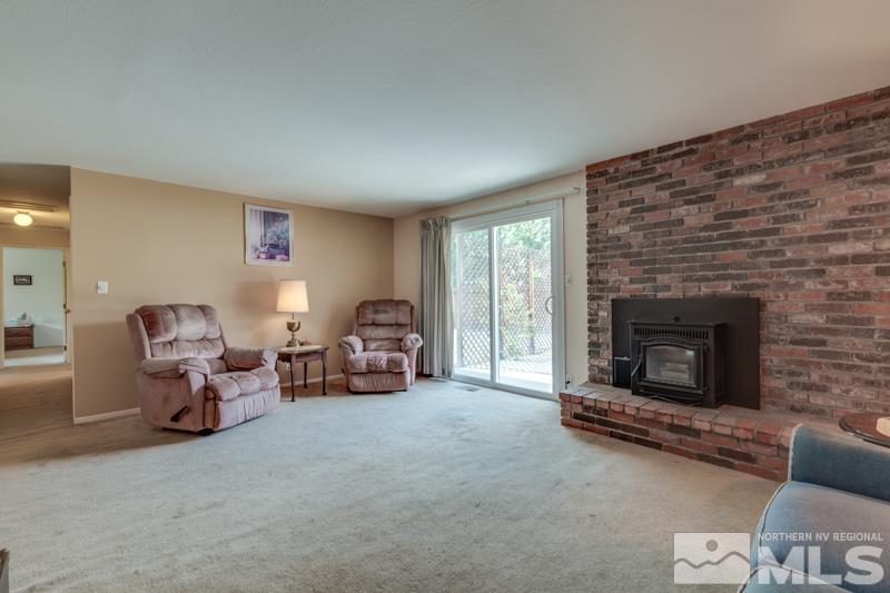4375 Valdez Way Reno, NV 89502 - Photo 8 of 22 a living room with furniture and a fireplace