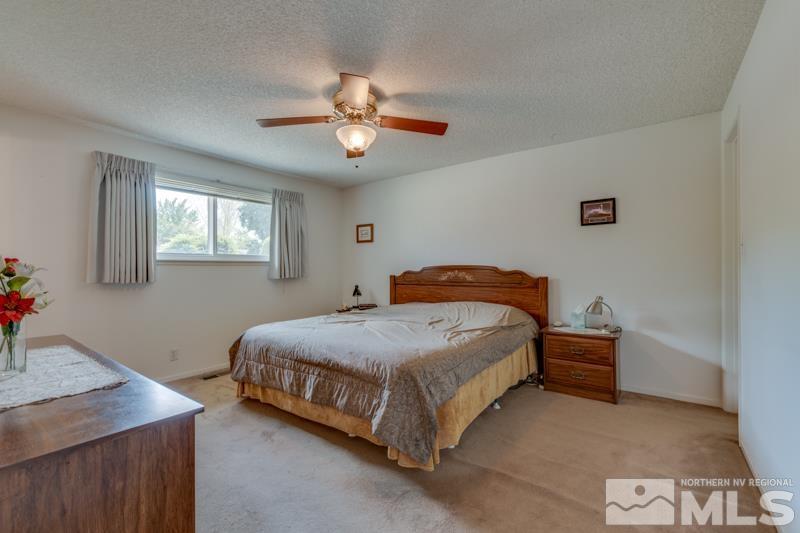 4375 Valdez Way Reno, NV 89502 - Photo 10 of 22 a bedroom with a bed and a table