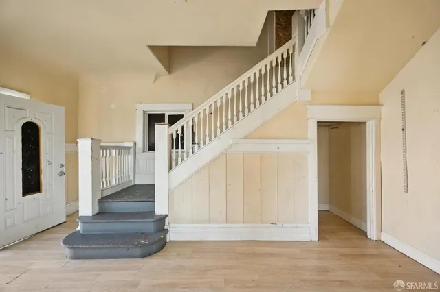 a view of entryway with wooden floor