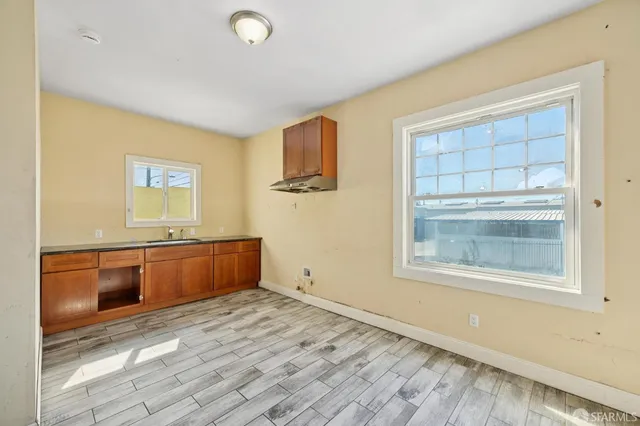 a room with window and dresser