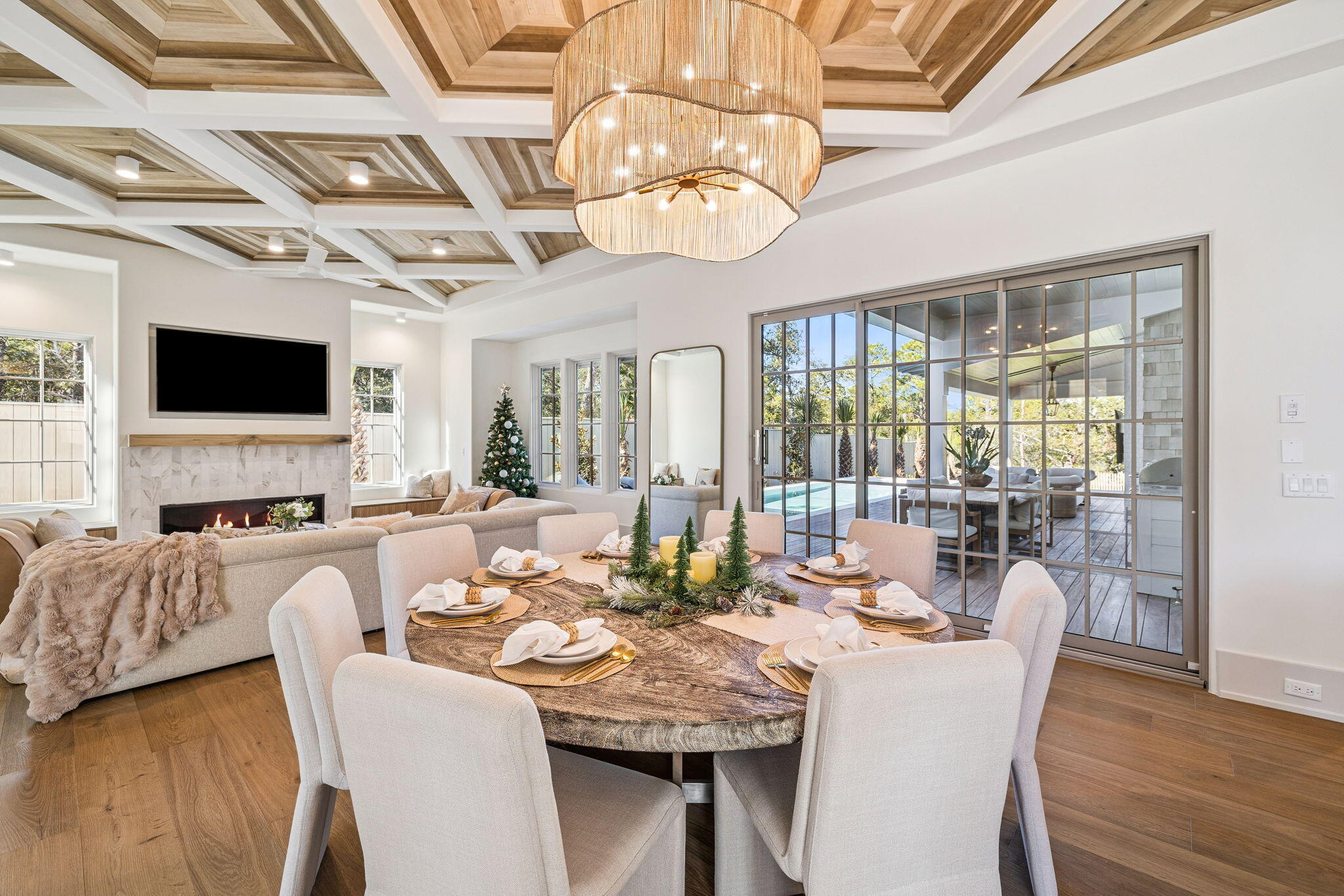 107 Pine Cone Trail Inlet Beach, FL 32461 - Photo 22 of 66 a view of a dining room with furniture a chandelier and wooden floor