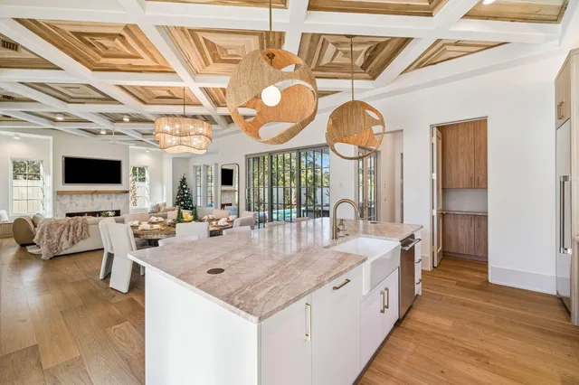 a view of a dining room with furniture wooden floor and chandelier