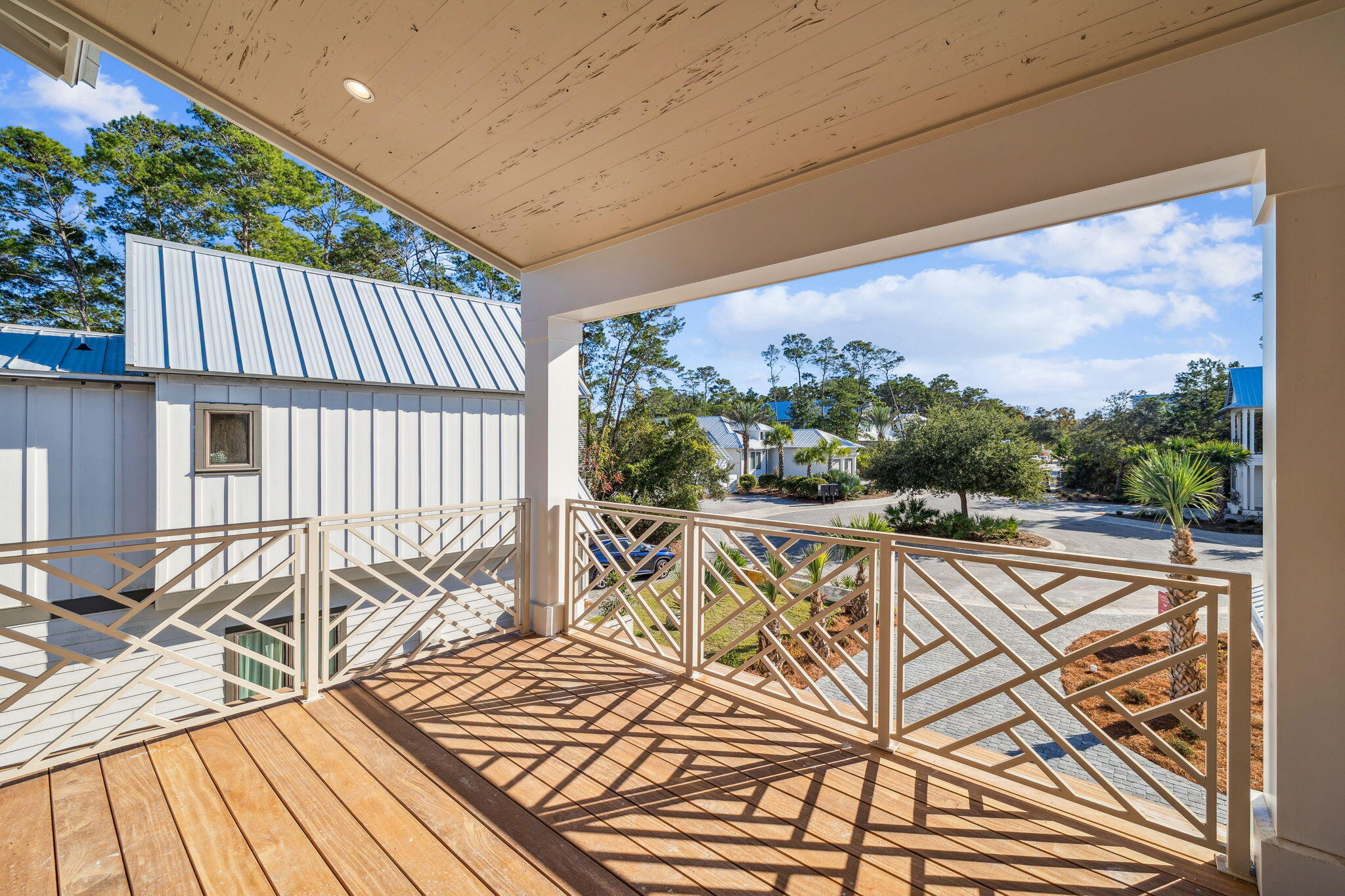 107 Pine Cone Trail Inlet Beach, FL 32461 - Photo 51 of 66 a view of balcony with wooden floor and outdoor seating