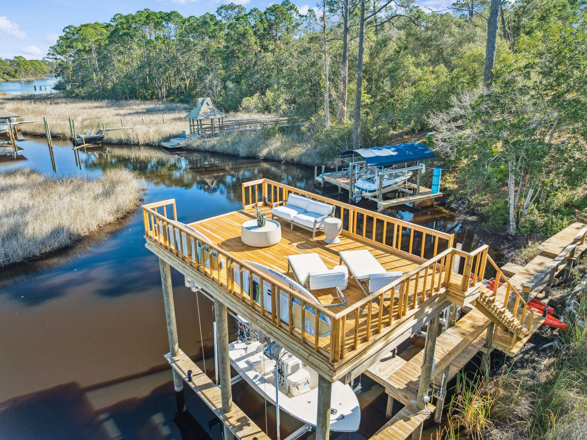 107 Pine Cone Trail Inlet Beach, FL 32461 - Photo 59 of 66 a view of a balcony with two chairs and a table