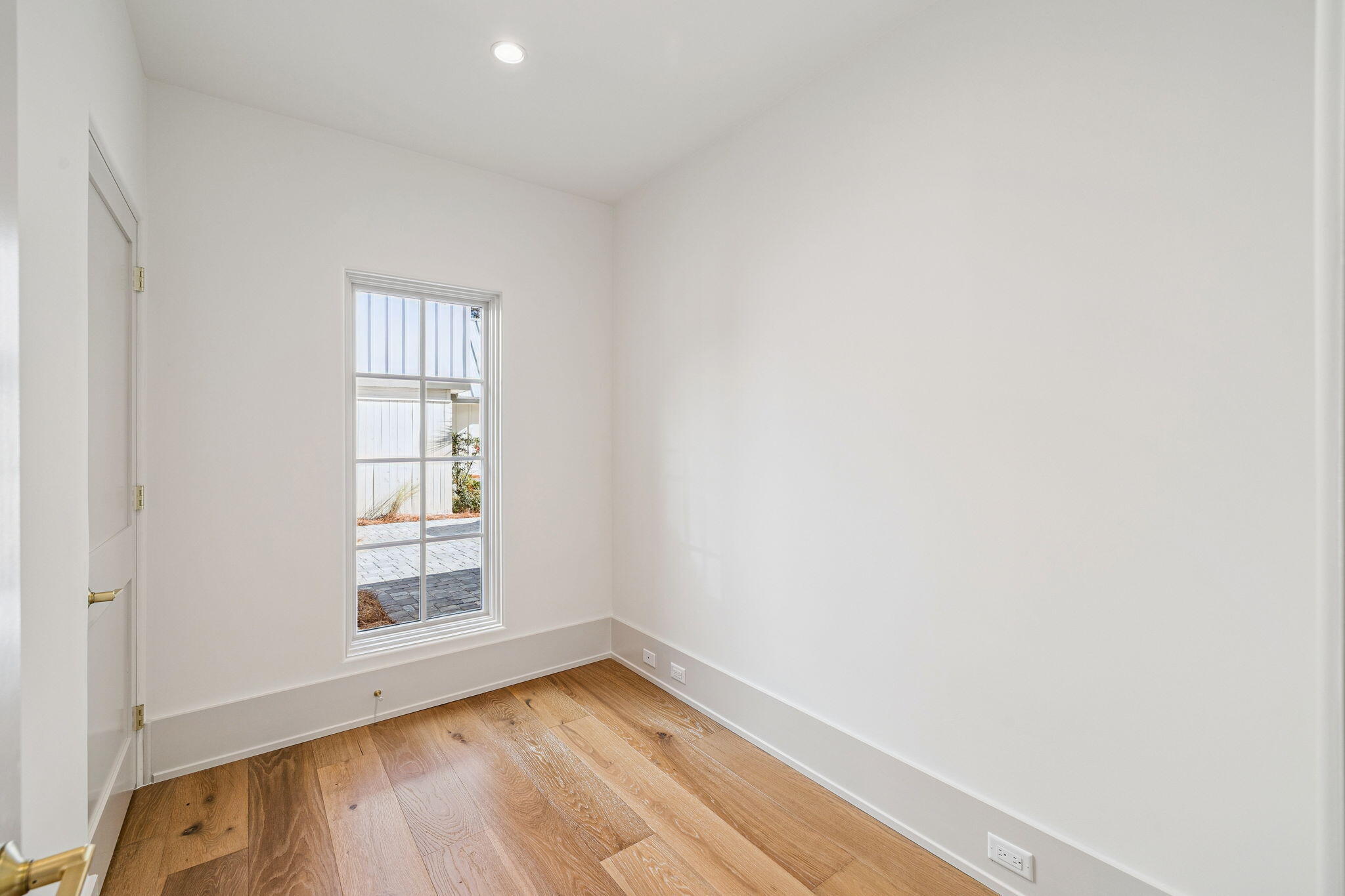 107 Pine Cone Trail Inlet Beach, FL 32461 - Photo 61 of 66 a view of an empty room with wooden floor and a window