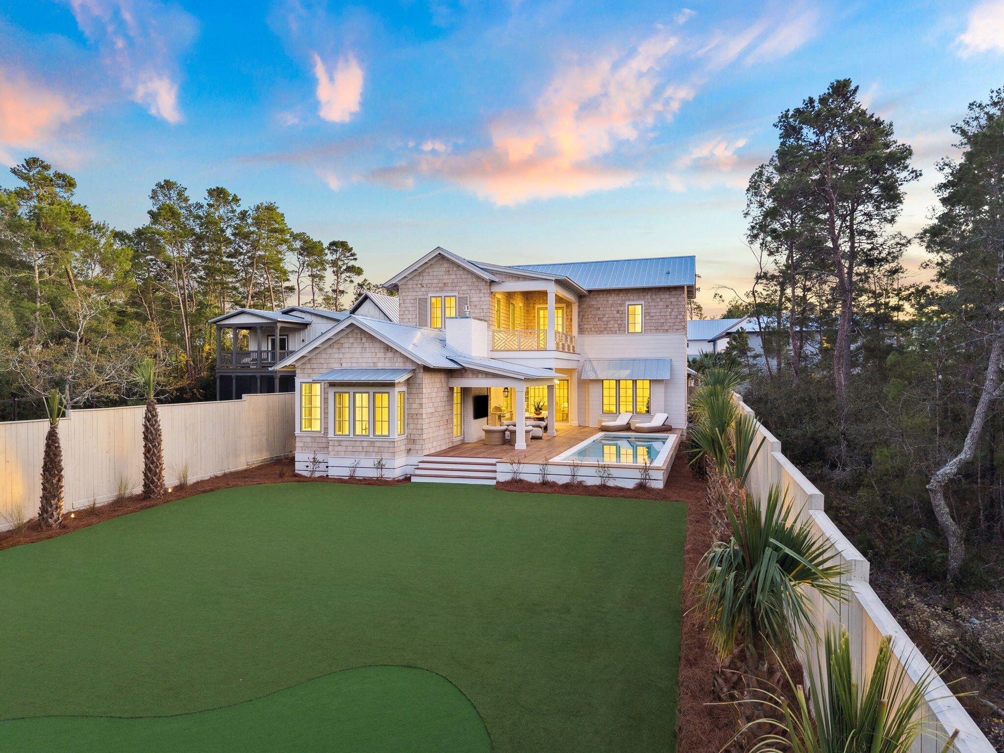 107 Pine Cone Trail Inlet Beach, FL 32461 - Photo 9 of 66 a front view of a house with a garden and yard