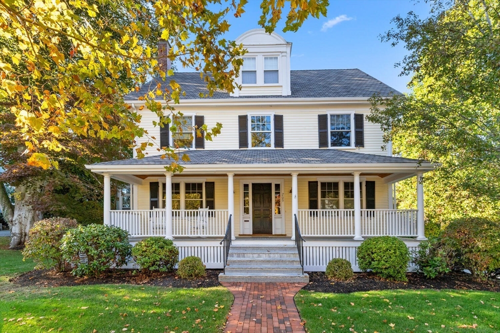 209 Waltham Street Lexington, MA 02421 - Photo 1 of 39 a front view of a house with garden