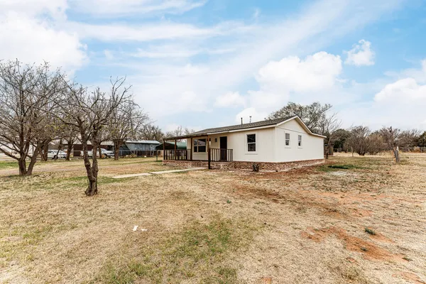 a view of house with outdoor space