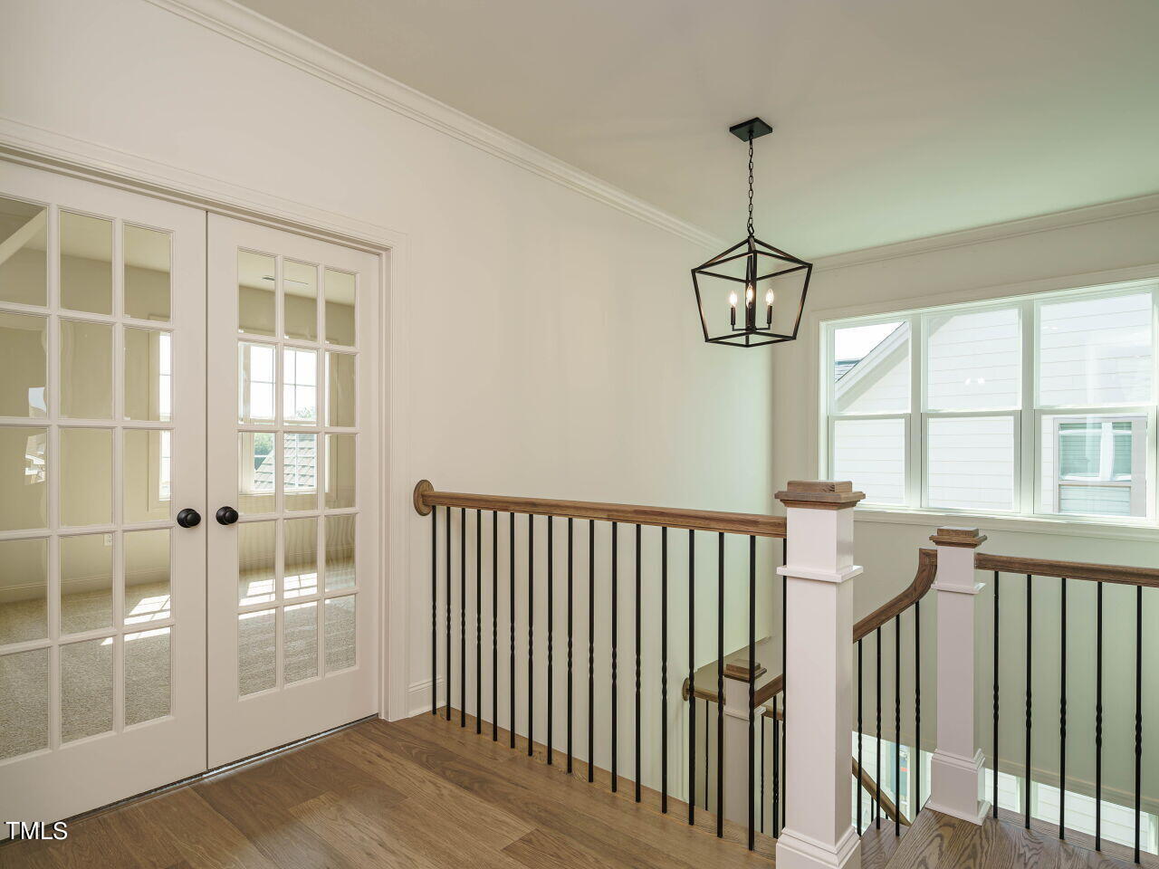 1528 Level Stream Road Wendell, NC 27591 - Photo 21 of 46 a view of a room with wooden floor and windows