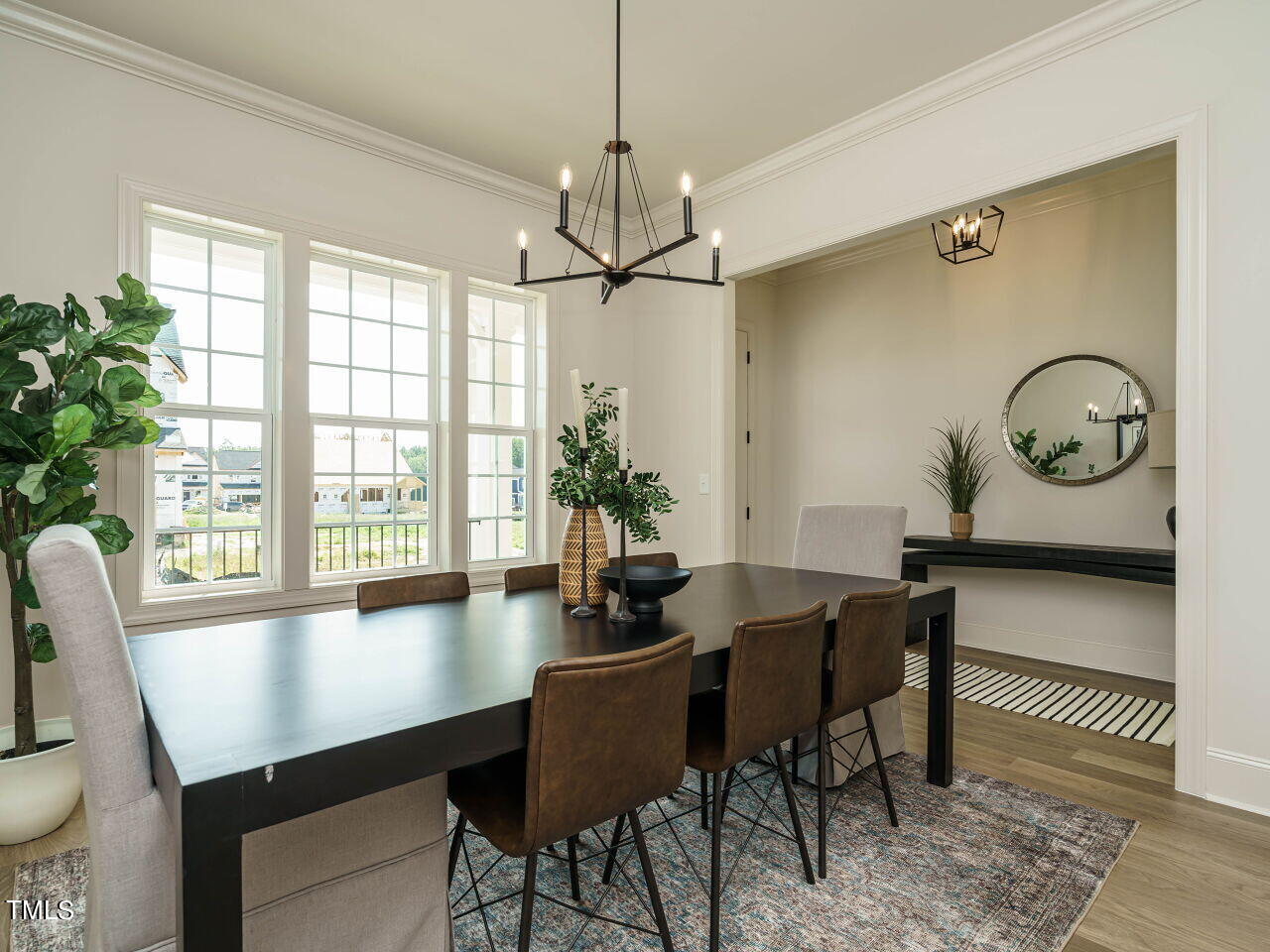 1528 Level Stream Road Wendell, NC 27591 - Photo 4 of 46 a view of a dining room with furniture window and wooden floor