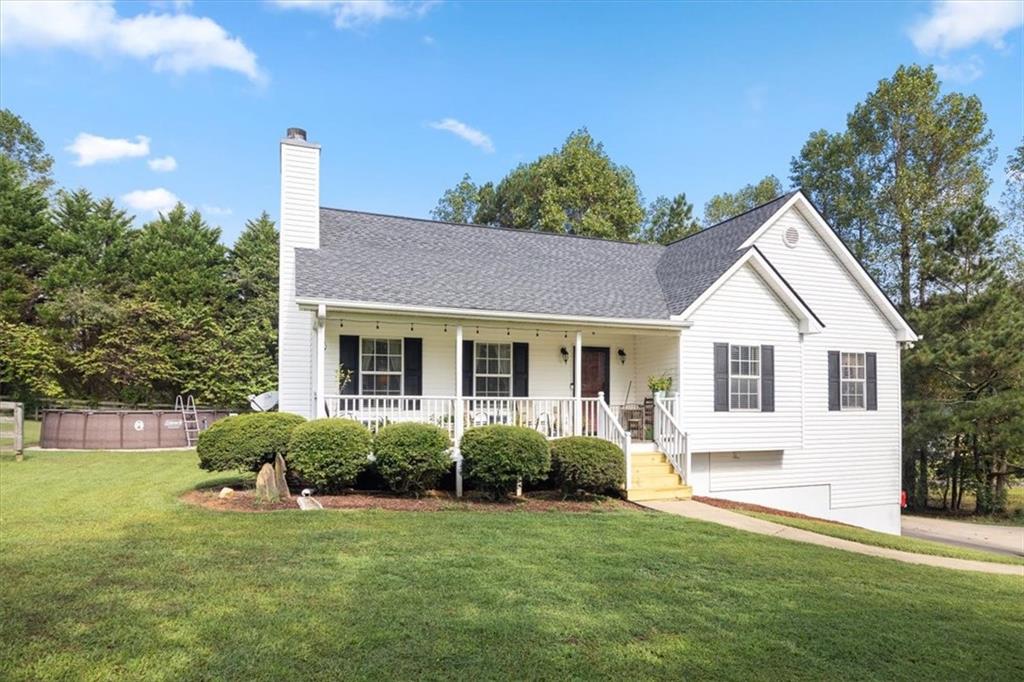 a front view of house with yard and green space