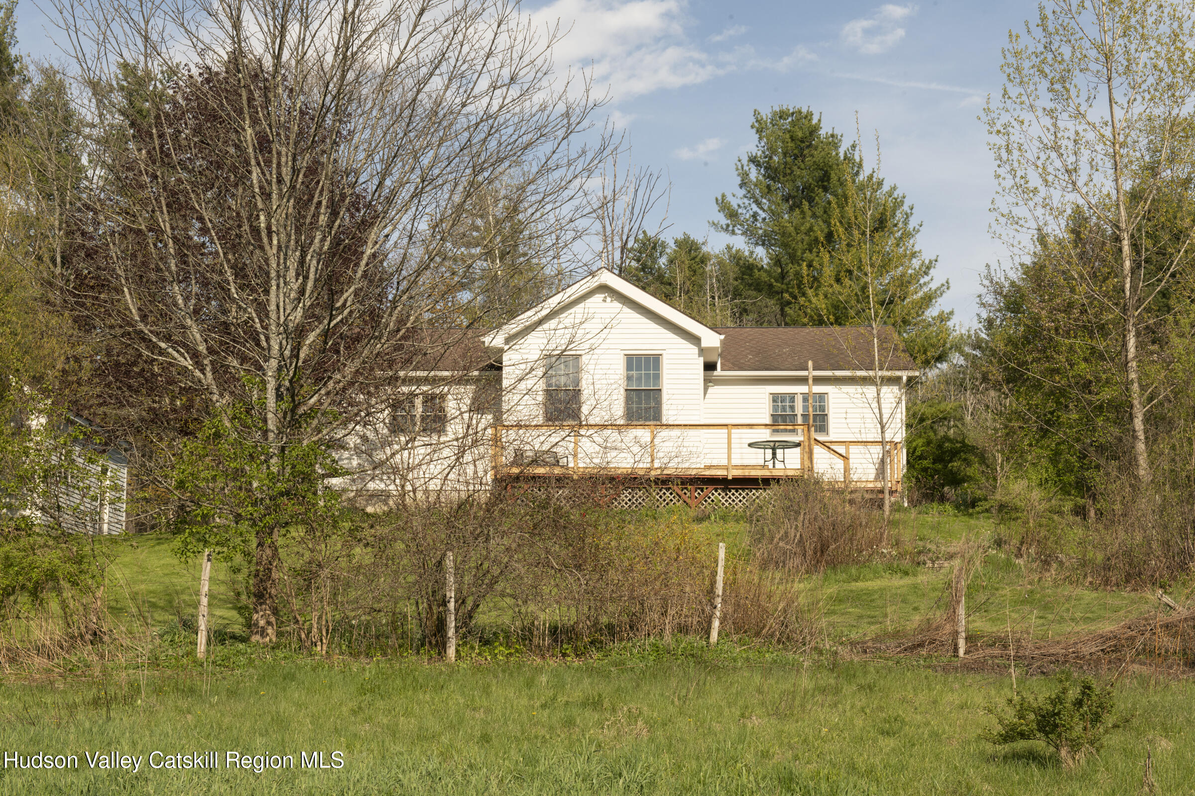 61 Schoolhouse Road New Lebanon, NY 12125 - Photo 19 of 22 a view of a house with a yard