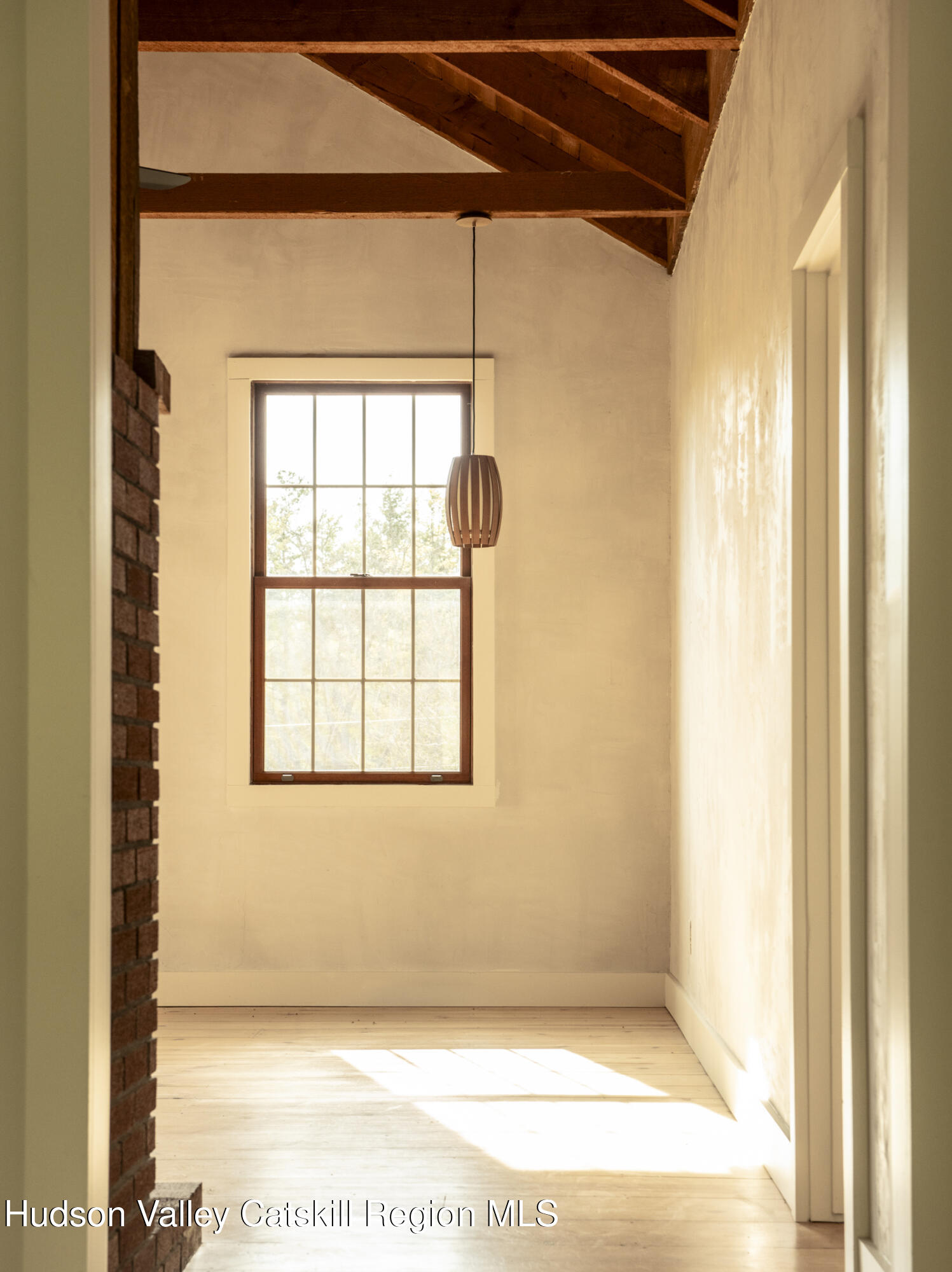61 Schoolhouse Road New Lebanon, NY 12125 - Photo 3 of 22 a view of a door and a window