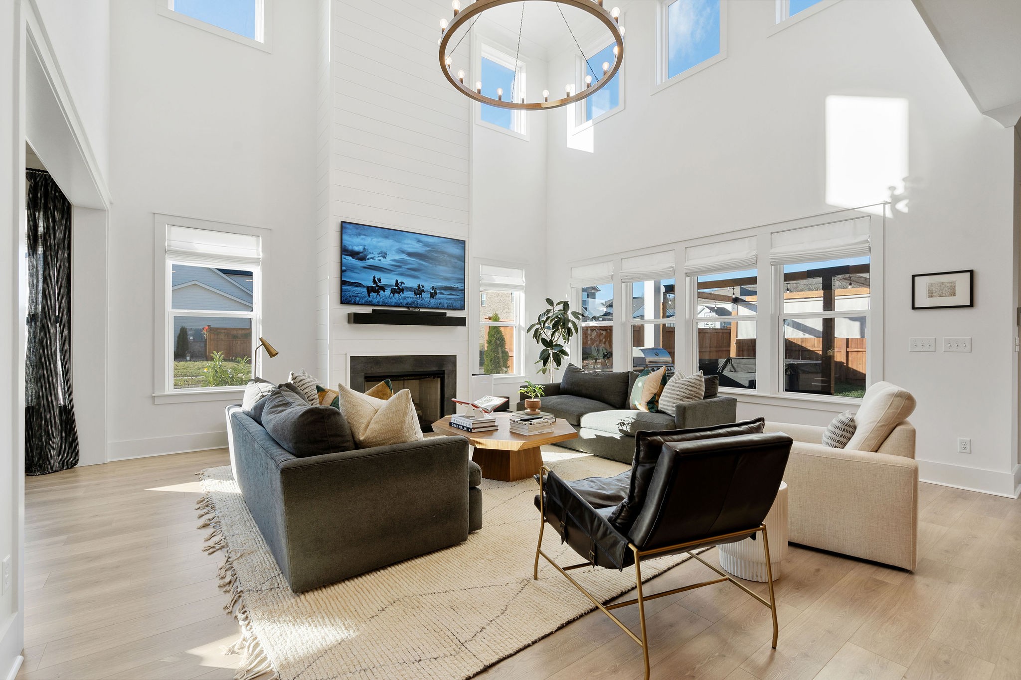 1052 Pine Creek Drive Arrington, TN 37014 - Photo 13 of 54 a living room with furniture a fireplace and a large window
