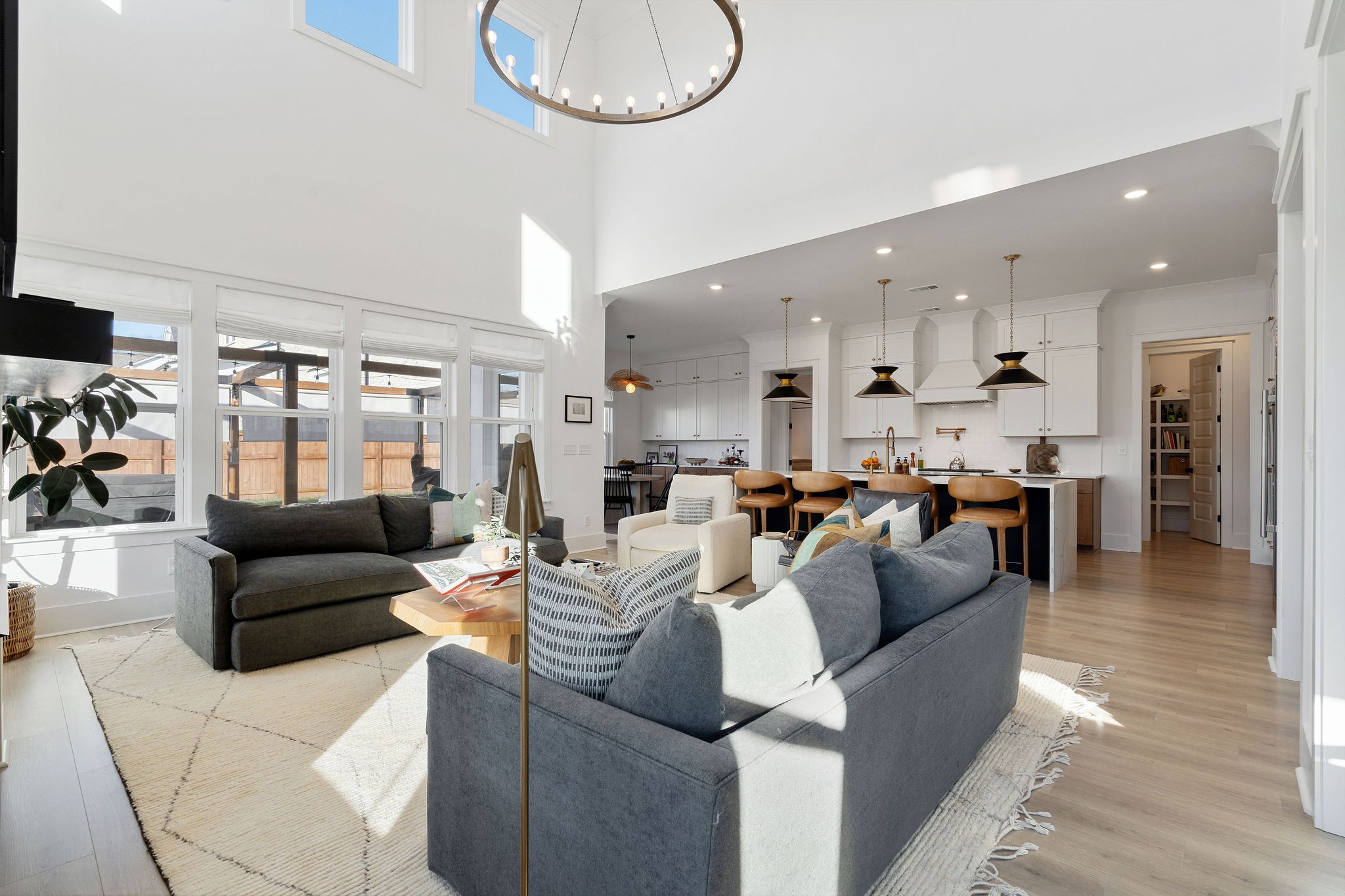 1052 Pine Creek Drive Arrington, TN 37014 - Photo 16 of 54 a living room with furniture kitchen view and a chandelier