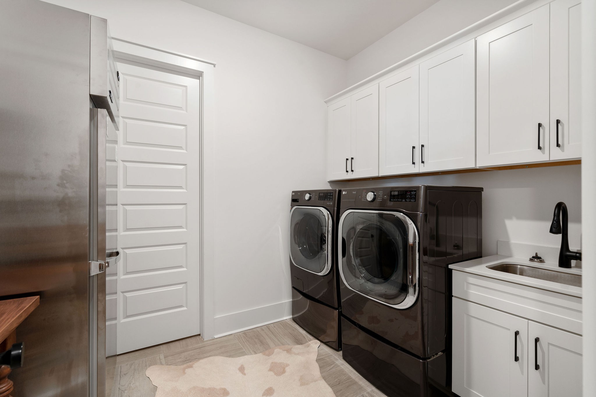 1052 Pine Creek Drive Arrington, TN 37014 - Photo 30 of 54 a utility room with cabinets washer and dryer