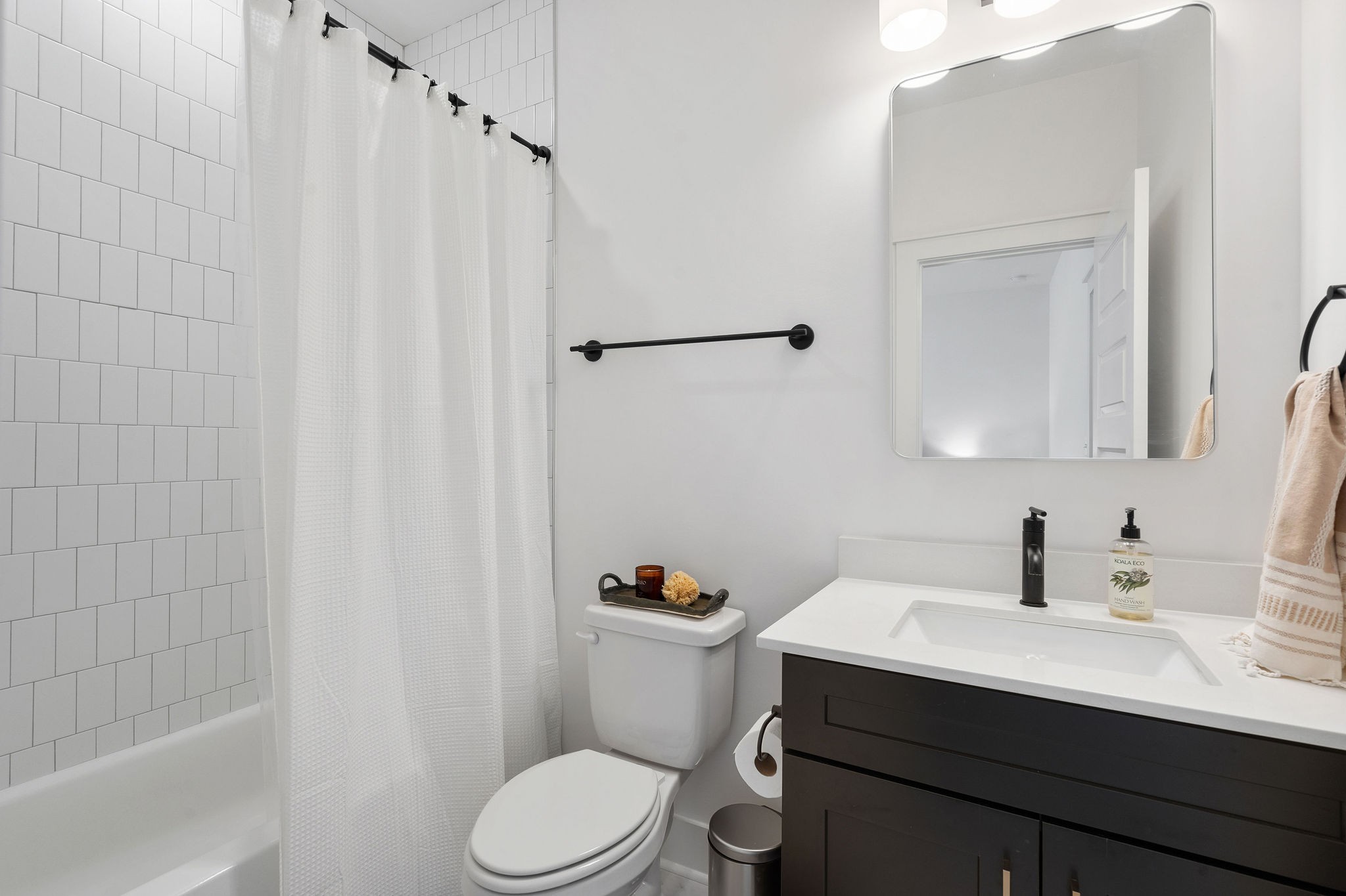 1052 Pine Creek Drive Arrington, TN 37014 - Photo 34 of 54 a bathroom with a sink a toilet and shower curtain