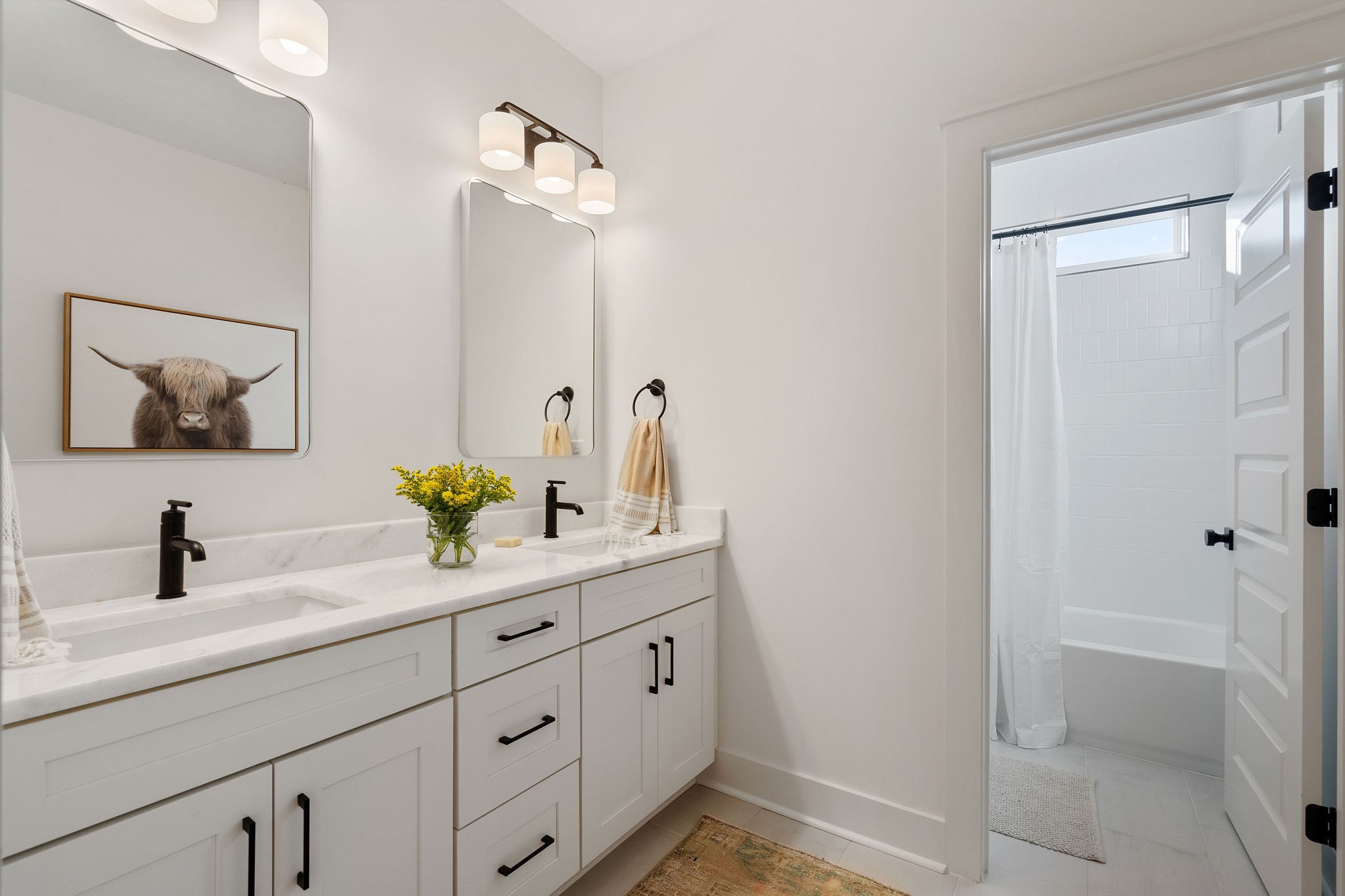 1052 Pine Creek Drive Arrington, TN 37014 - Photo 36 of 54 a bathroom with a double vanity sink and a mirror