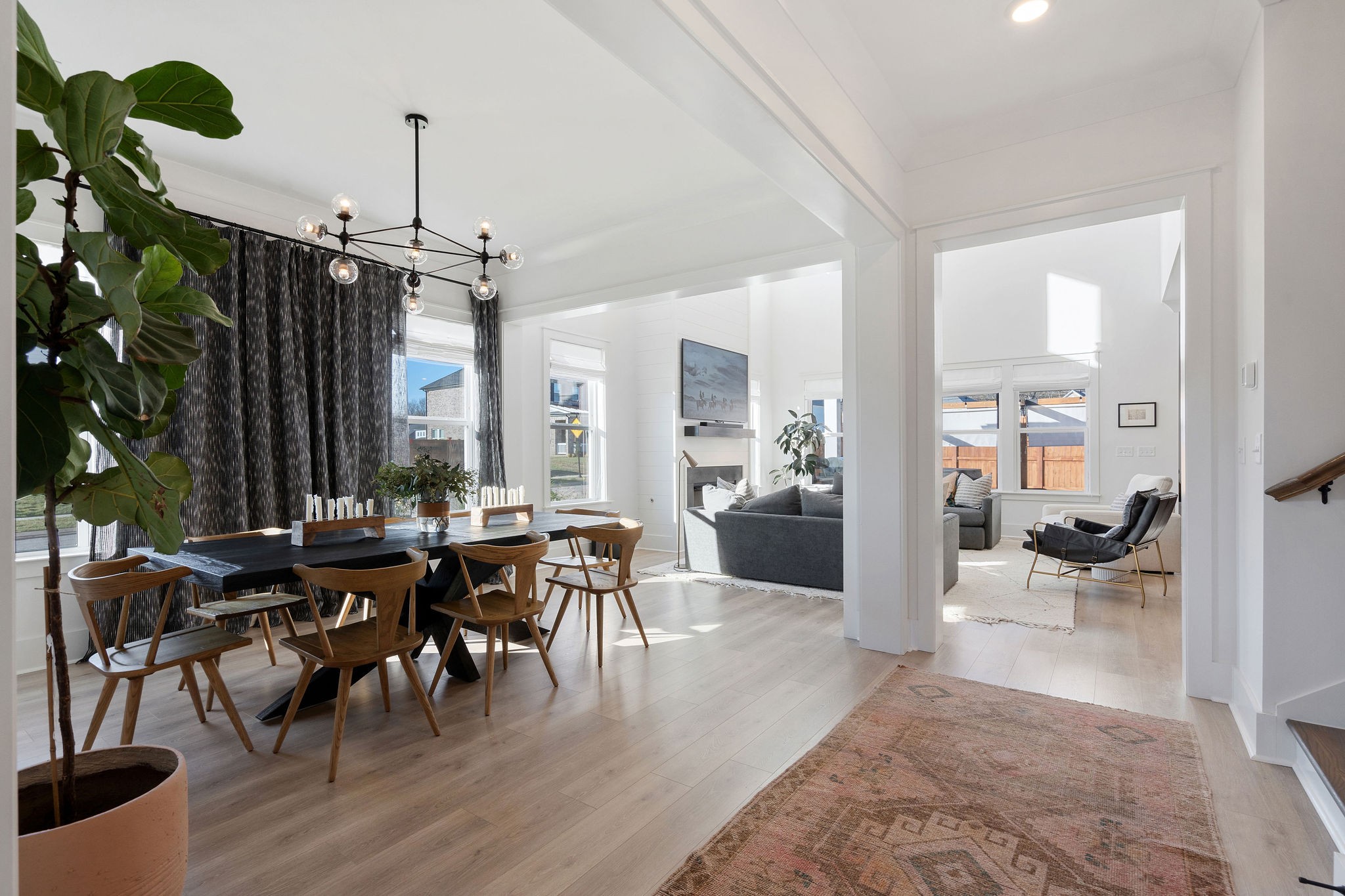 1052 Pine Creek Drive Arrington, TN 37014 - Photo 8 of 54 a view of a dining room and livingroom with furniture wooden floor a chandelier