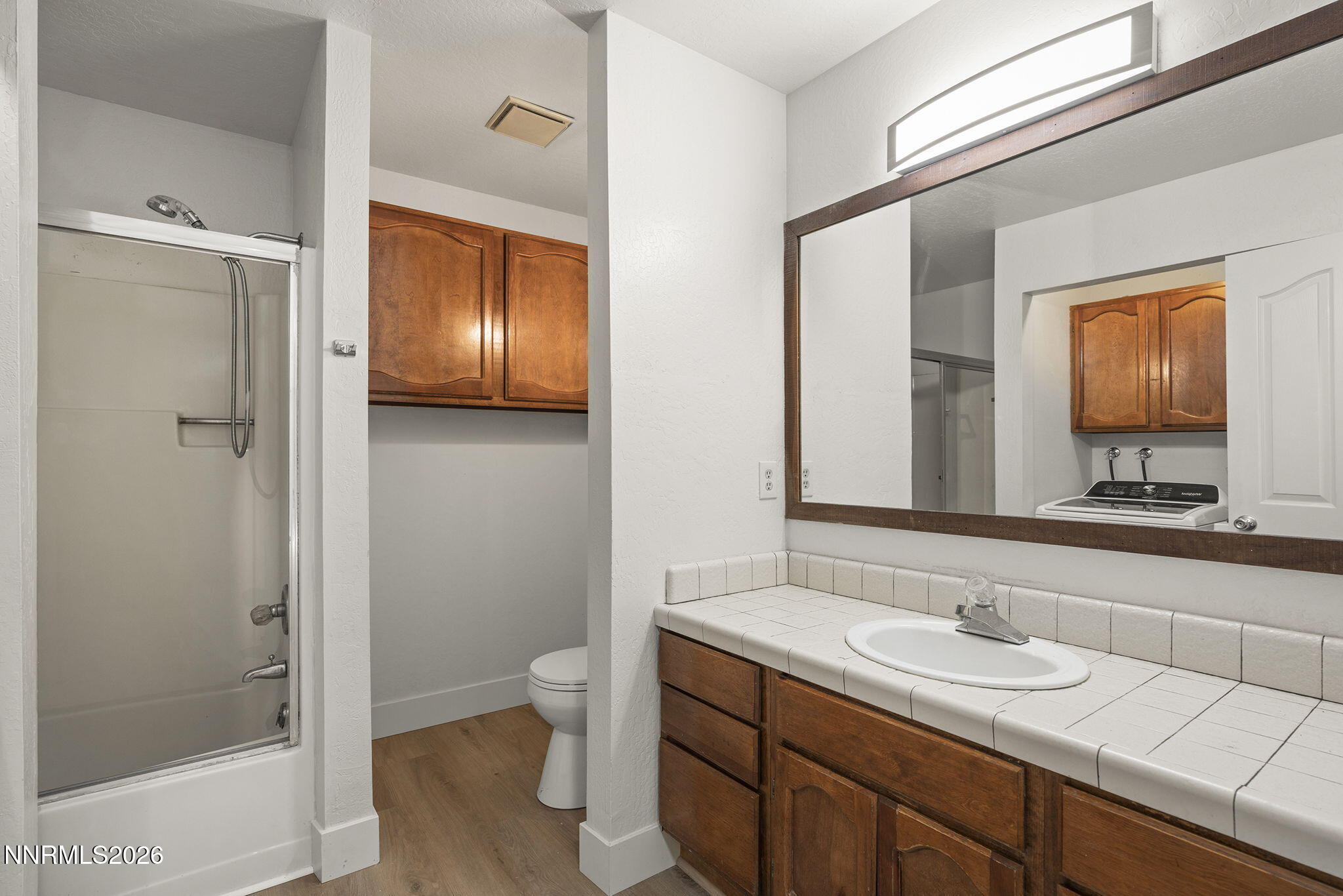 179 Tramway Drive, Unit B Stateline, NV 89449 - Photo 13 of 29 a bathroom with a sink a toilet and shower