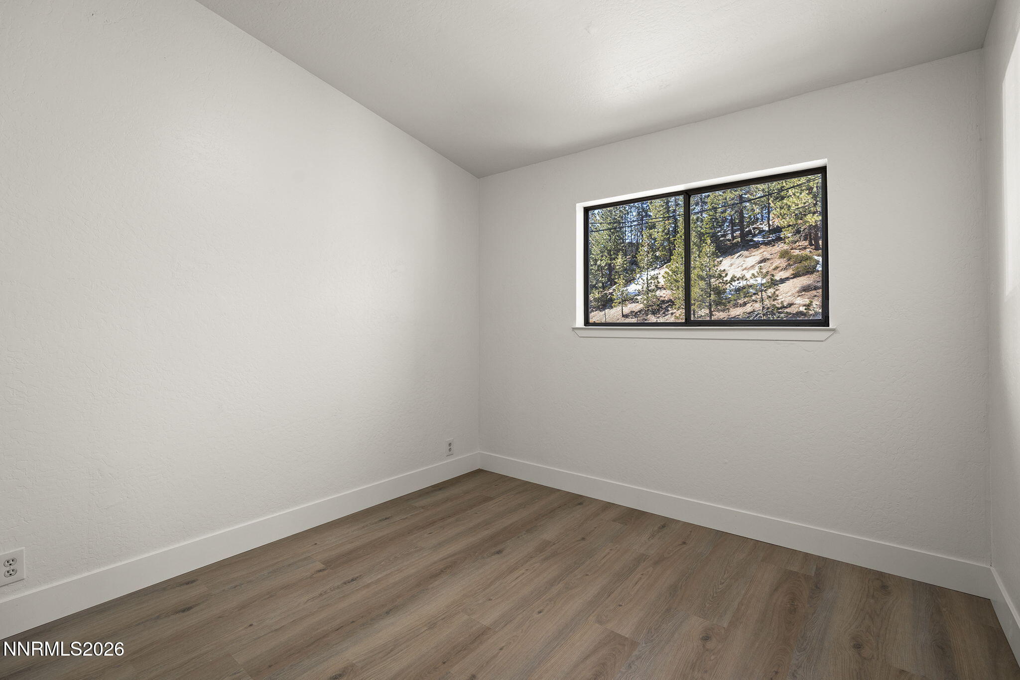 179 Tramway Drive, Unit B Stateline, NV 89449 - Photo 15 of 29 an empty room with a window