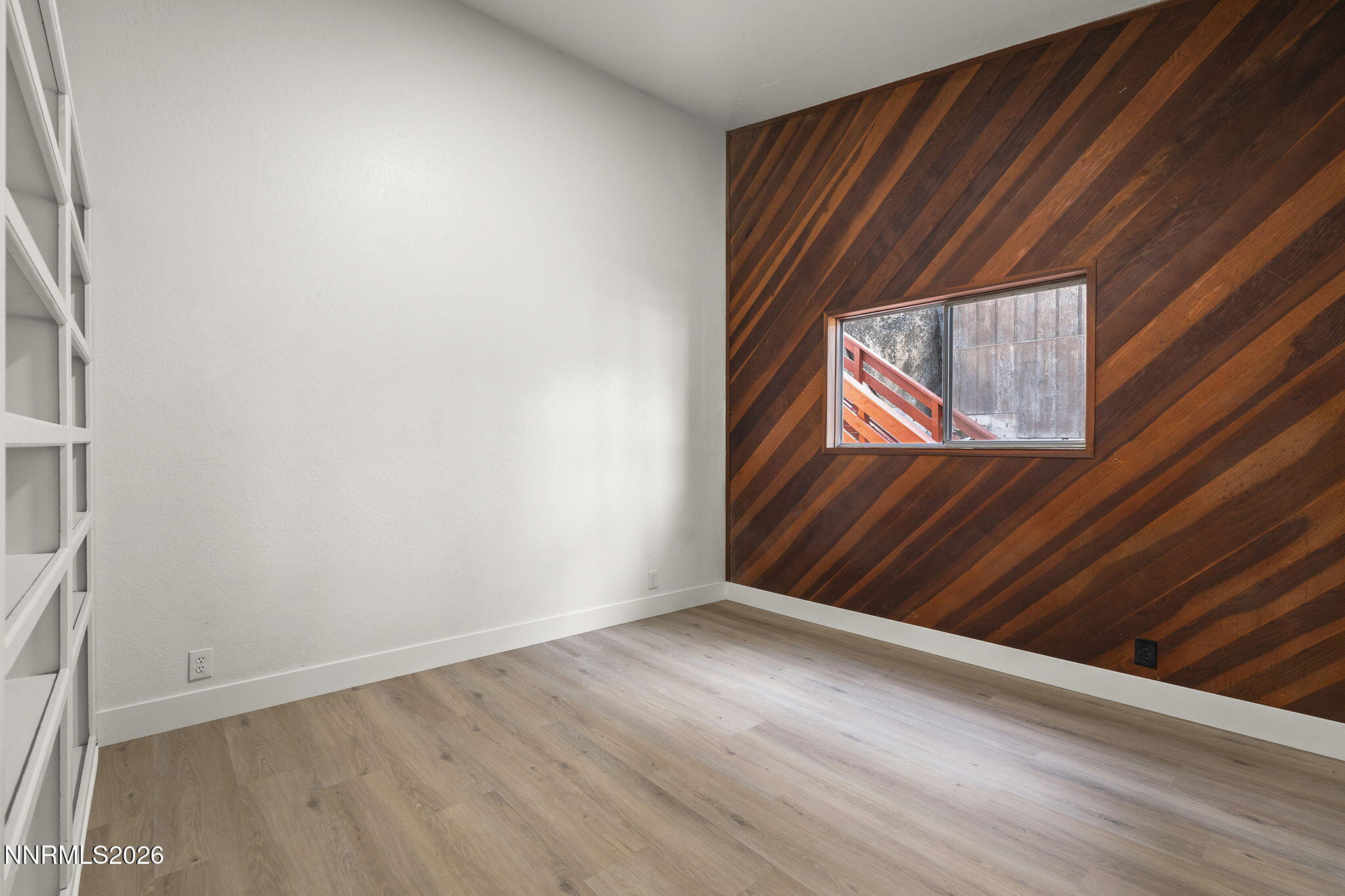 179 Tramway Drive, Unit B Stateline, NV 89449 - Photo 17 of 29 a view of an empty room and wooden floor