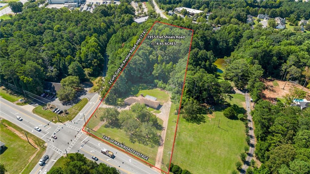 1955 Flat Shoals Road Southeast Conyers, GA 30013 - Photo 1 of 56 an aerial view of a residential houses with yard