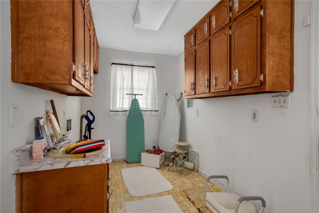 1955 Flat Shoals Road Southeast Conyers, GA 30013 - Photo 19 of 56 a room with storage and utility