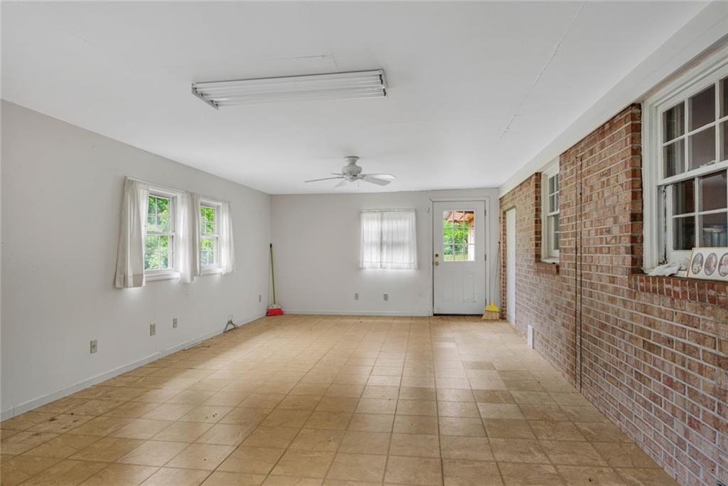 1955 Flat Shoals Road Southeast Conyers, GA 30013 - Photo 23 of 56 a view of livingroom with hardwood