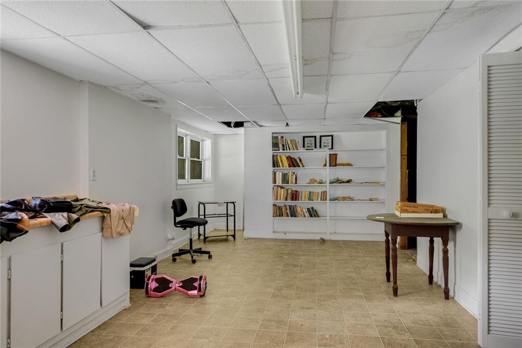 1955 Flat Shoals Road Southeast Conyers, GA 30013 - Photo 36 of 56 a view of a room with gym equipment