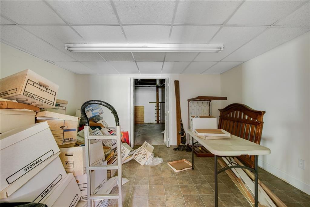 1955 Flat Shoals Road Southeast Conyers, GA 30013 - Photo 39 of 56 a workspace with furniture rug and a window