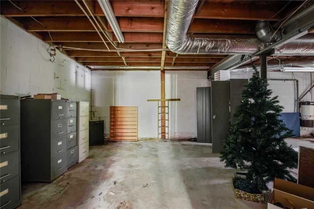 1955 Flat Shoals Road Southeast Conyers, GA 30013 - Photo 40 of 56 a view of storage and utility room