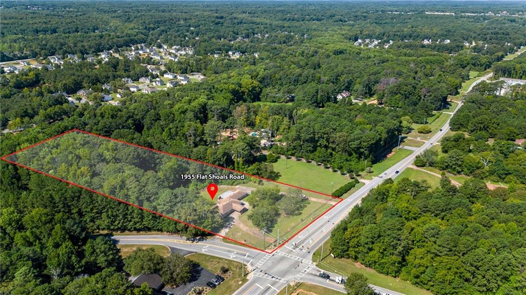 1955 Flat Shoals Road Southeast Conyers, GA 30013 - Photo 51 of 56 an aerial view of green landscape with trees houses and mountain view