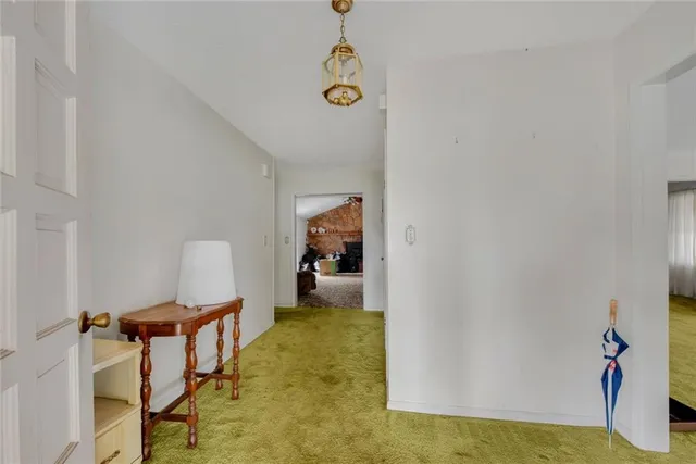 a hallway with sliding door and yard in back