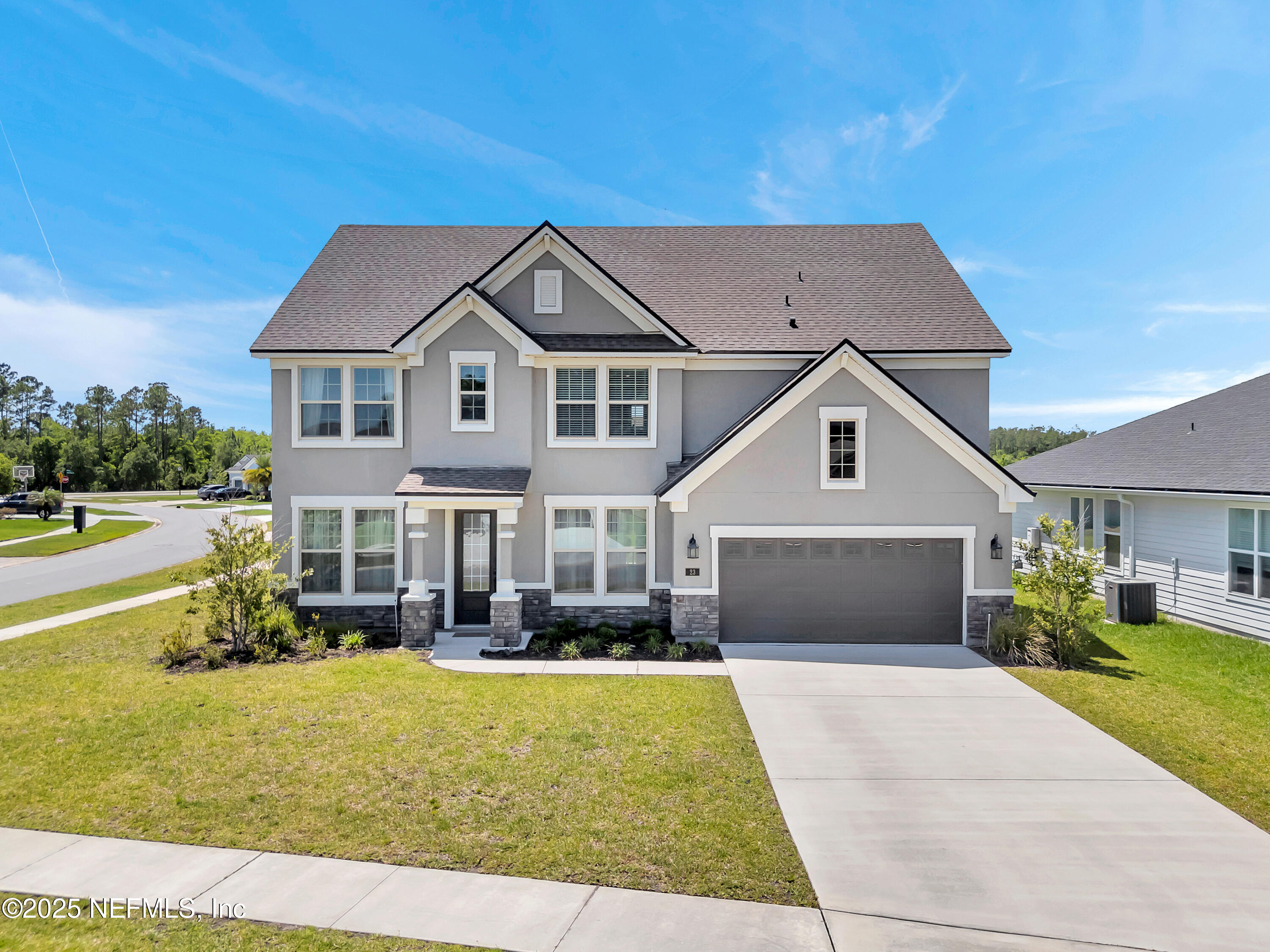 a front view of a house with garden