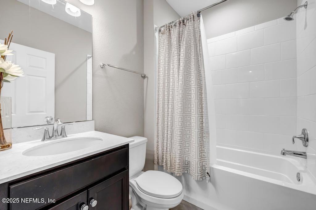 23 Catesby Lane St. Augustine, FL 32095 - Photo 12 of 31 a bathroom with a sink a toilet and shower